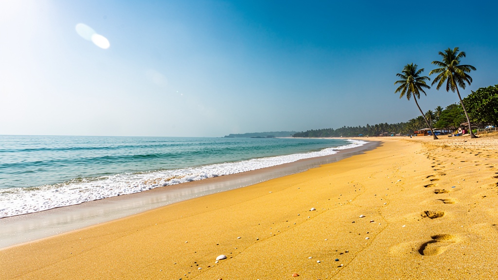 Wide clean beach of Ghoghla with calm sea