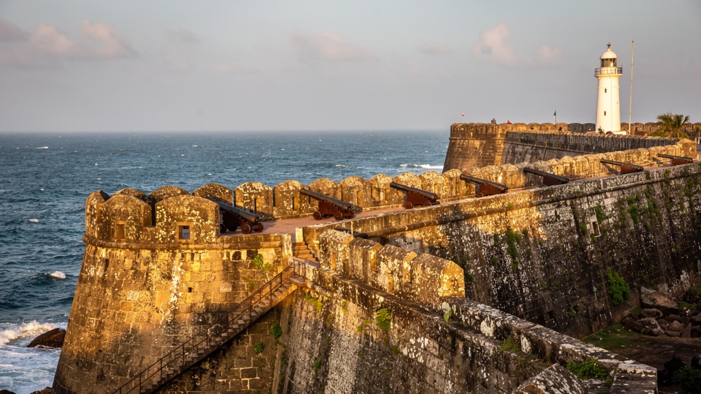 Stone ramparts and bastions of Diu Fort with the sea below