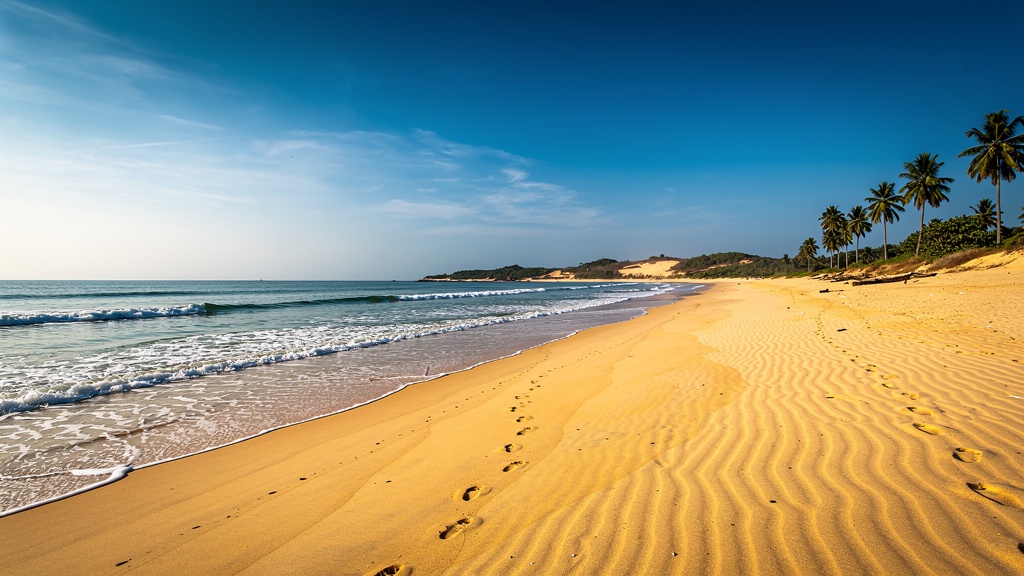Vast golden Ghoghla beach with calm sea and few people