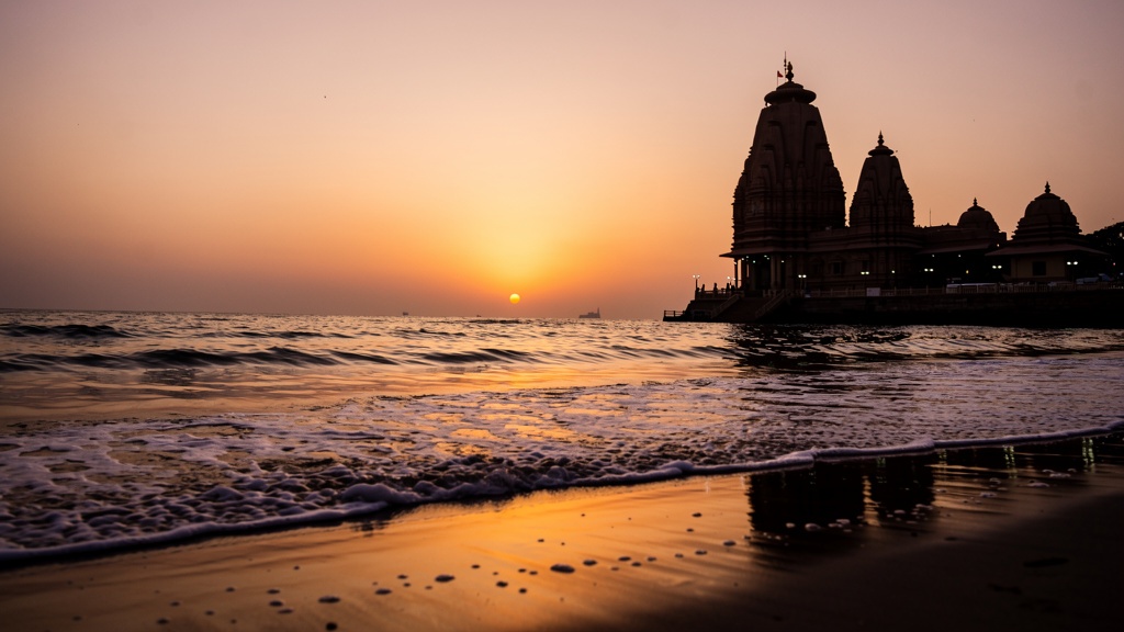 Somnath Temple silhouette by the Arabian Sea at dusk